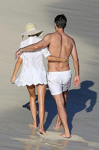 Olivia Palermo sunbathing without bra on the beach in St. Barths