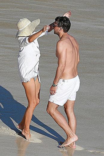 Olivia Palermo sunbathing without bra on the beach in St. Barths