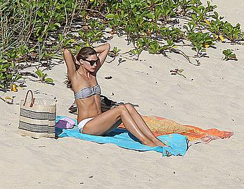 Olivia Palermo sunbathing without bra on the beach in St. Barths