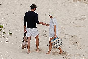 Olivia Palermo sunbathing without bra on the beach in St. Barths