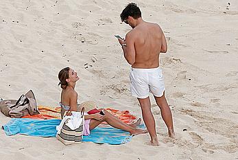 Olivia Palermo sunbathing without bra on the beach in St. Barths