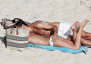 Olivia Palermo sunbathing without bra on the beach in St. Barths