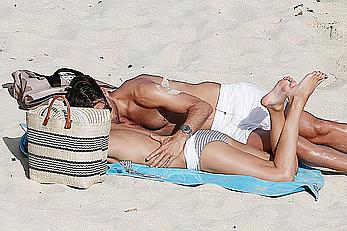 Olivia Palermo sunbathing without bra on the beach in St. Barths