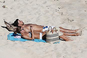 Olivia Palermo sunbathing without bra on the beach in St. Barths