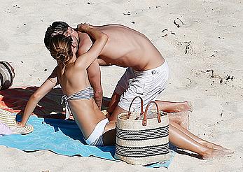 Olivia Palermo sunbathing without bra on the beach in St. Barths