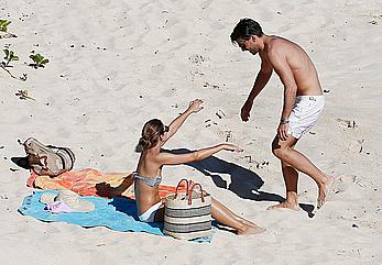 Olivia Palermo sunbathing without bra on the beach in St. Barths