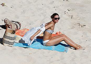 Olivia Palermo sunbathing without bra on the beach in St. Barths