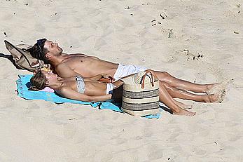 Olivia Palermo sunbathing without bra on the beach in St. Barths