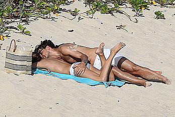 Olivia Palermo sunbathing without bra on the beach in St. Barths