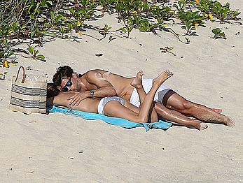 Olivia Palermo sunbathing without bra on the beach in St. Barths