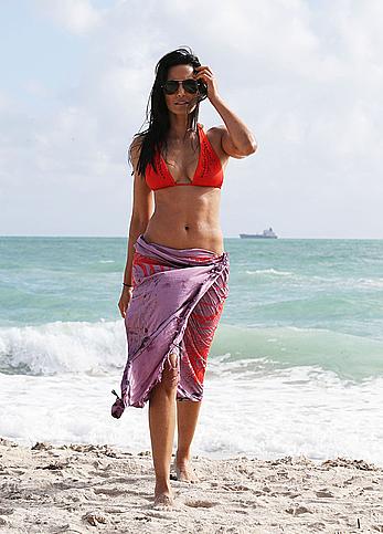 Indian actress Padma Lakshmi hard nipples under red bikini in Miami