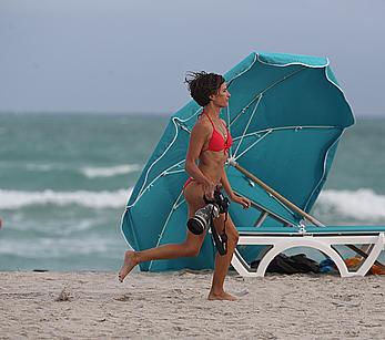 Paparazzo Logan Fazio poses in a bikini on Miami Beach