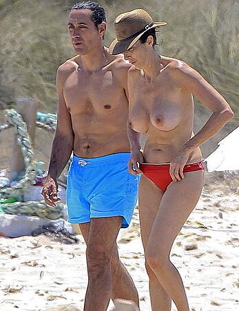 Spanish actress Paz Padilla topless on a beach paparazzi shots