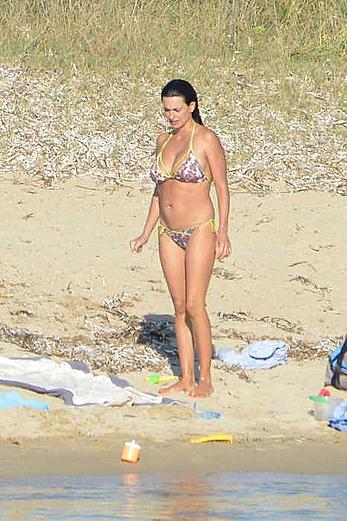 Penelope Cruz caught topless on the beach in Corsica