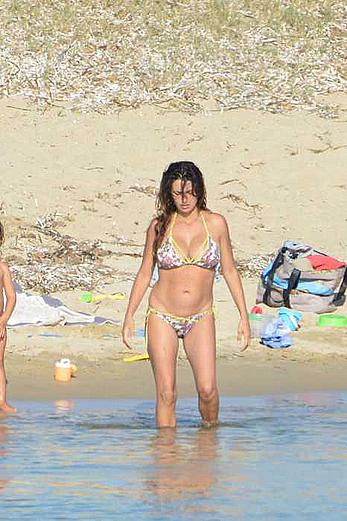 Penelope Cruz caught topless on the beach in Corsica