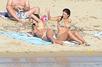 Penelope Cruz caught topless on the beach in Corsica