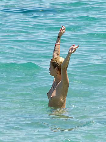 Pixie Geldof caught topless on the Beach in Ibiza