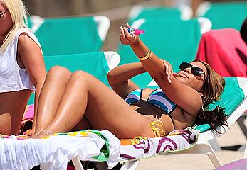 UK Big Brother 11 babe Rachael White in bikini and topless on a beach paparazzi photos