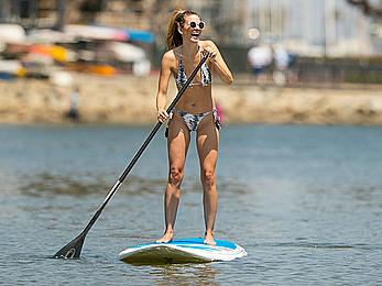 Rachel McCord in a bikini paddle boarding in Marina del Rey