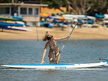 Rachel McCord in a bikini paddle boarding in Marina del Rey