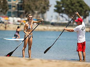 Rachel McCord in a bikini paddle boarding in Marina del Rey