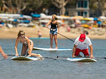 Rachel McCord in a bikini paddle boarding in Marina del Rey