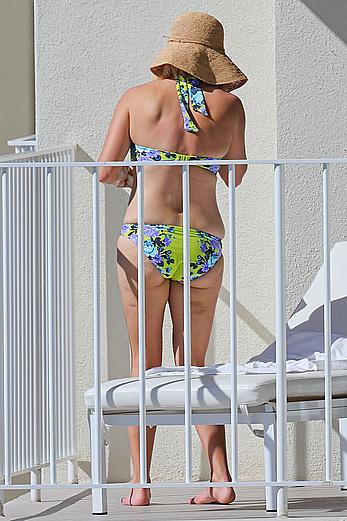 Reese Witherspoon in bikini on balcony of the Turtle Bay Resort in Oahu