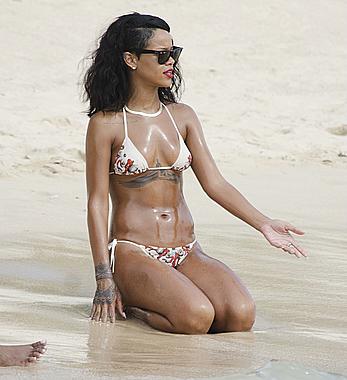 Rihanna at the beach doing a photo shoot in Barbados