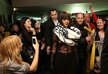 Rihanna nude tits under transparent top Jean Paul Gaultier fashion show in Paris