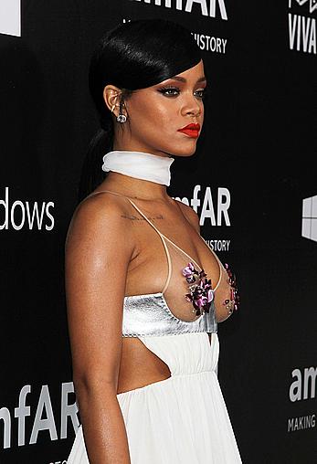 Rihanna covers up her nipples at amfAR LA Inspiration Gala in Hollywood