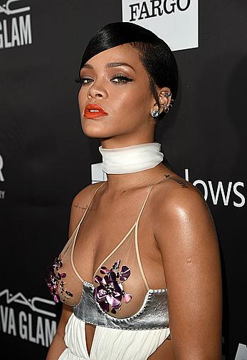 Rihanna covers up her nipples at amfAR LA Inspiration Gala in Hollywood