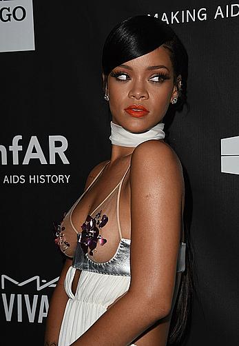 Rihanna covers up her nipples at amfAR LA Inspiration Gala in Hollywood