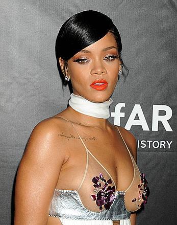 Rihanna covers up her nipples at amfAR LA Inspiration Gala in Hollywood