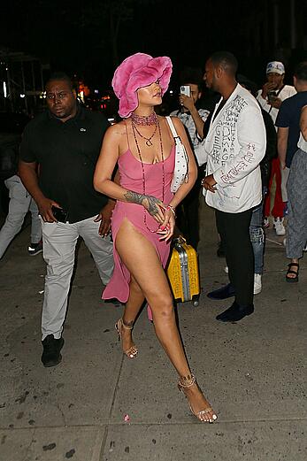 Rihanna braless in a see throught dress out at night in New York