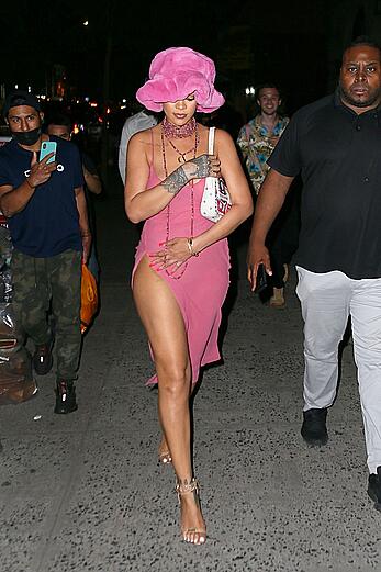 Rihanna braless in a see throught dress out at night in New York