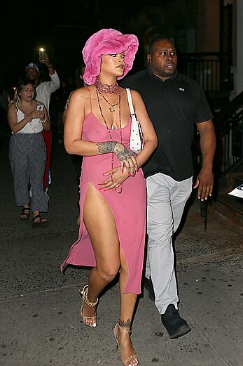 Rihanna braless in a see throught dress out at night in New York