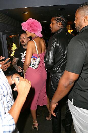 Rihanna braless in a see throught dress out at night in New York