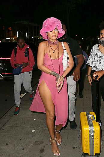 Rihanna braless in a see throught dress out at night in New York