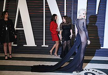 Rita Ora no bra and pants under dress at 2015 Vanity Fair Oscar Party in Hollywood