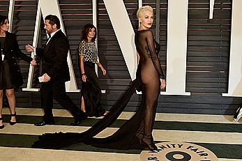 Rita Ora no bra and pants under dress at 2015 Vanity Fair Oscar Party in Hollywood