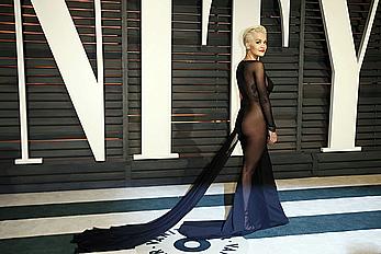 Rita Ora no bra and pants under dress at 2015 Vanity Fair Oscar Party in Hollywood