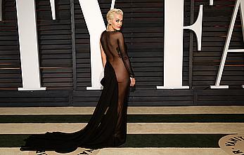 Rita Ora no bra and pants under dress at 2015 Vanity Fair Oscar Party in Hollywood