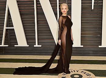 Rita Ora no bra and pants under dress at 2015 Vanity Fair Oscar Party in Hollywood