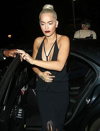 Rita Ora side of boob in a car in London