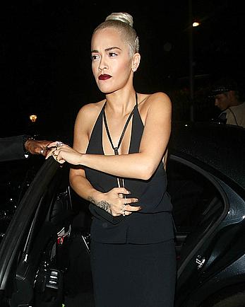 Rita Ora side of boob in a car in London