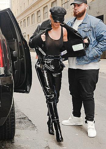 Rita Ora in see through black top in NYC