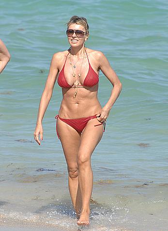 Rita Rusic in red bikini at a beach