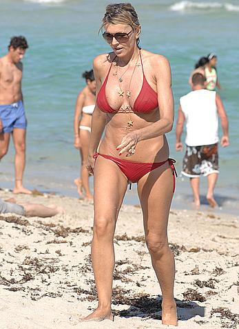 Rita Rusic in red bikini at a beach