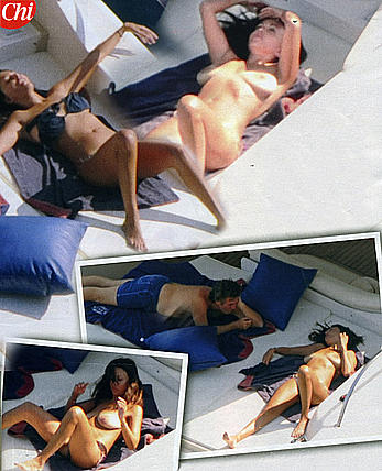 Busty Sabrina Ferilli sunbathing topless on a yacht