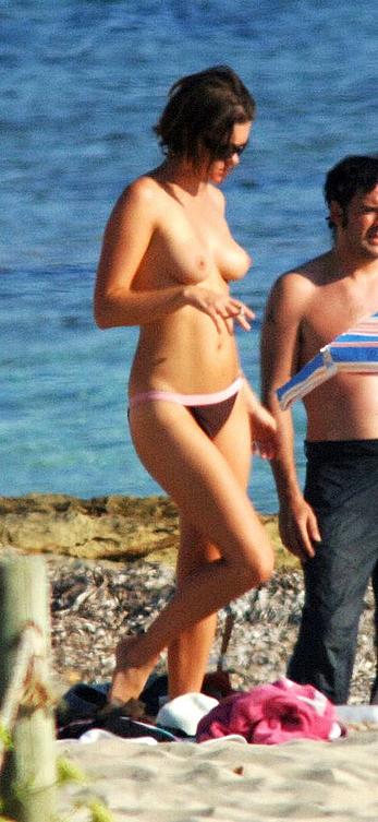 Sadie Frost topless on a beach